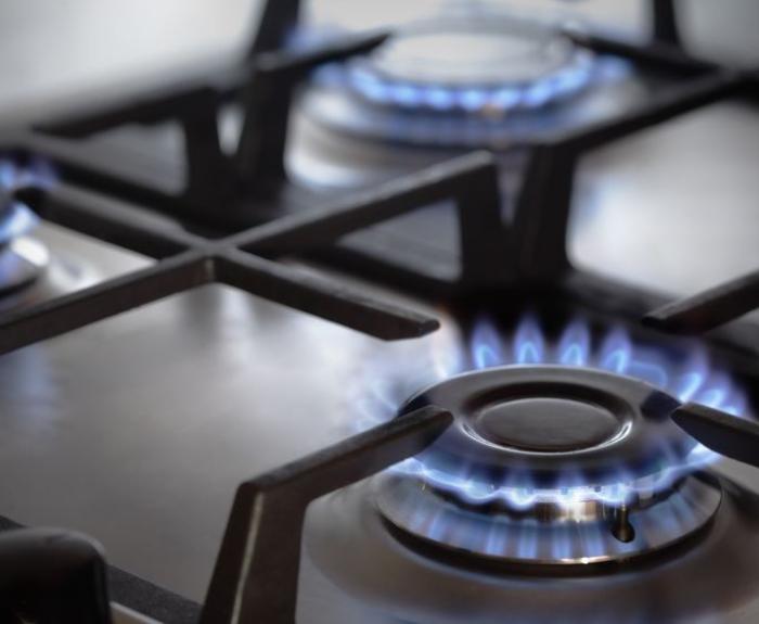Image of gas stove with the burners on