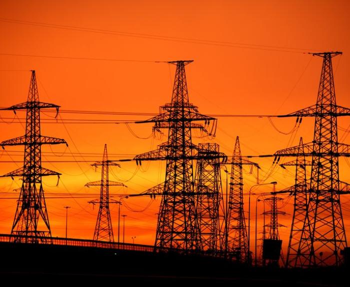 Picture of powerlines with sunset behind them